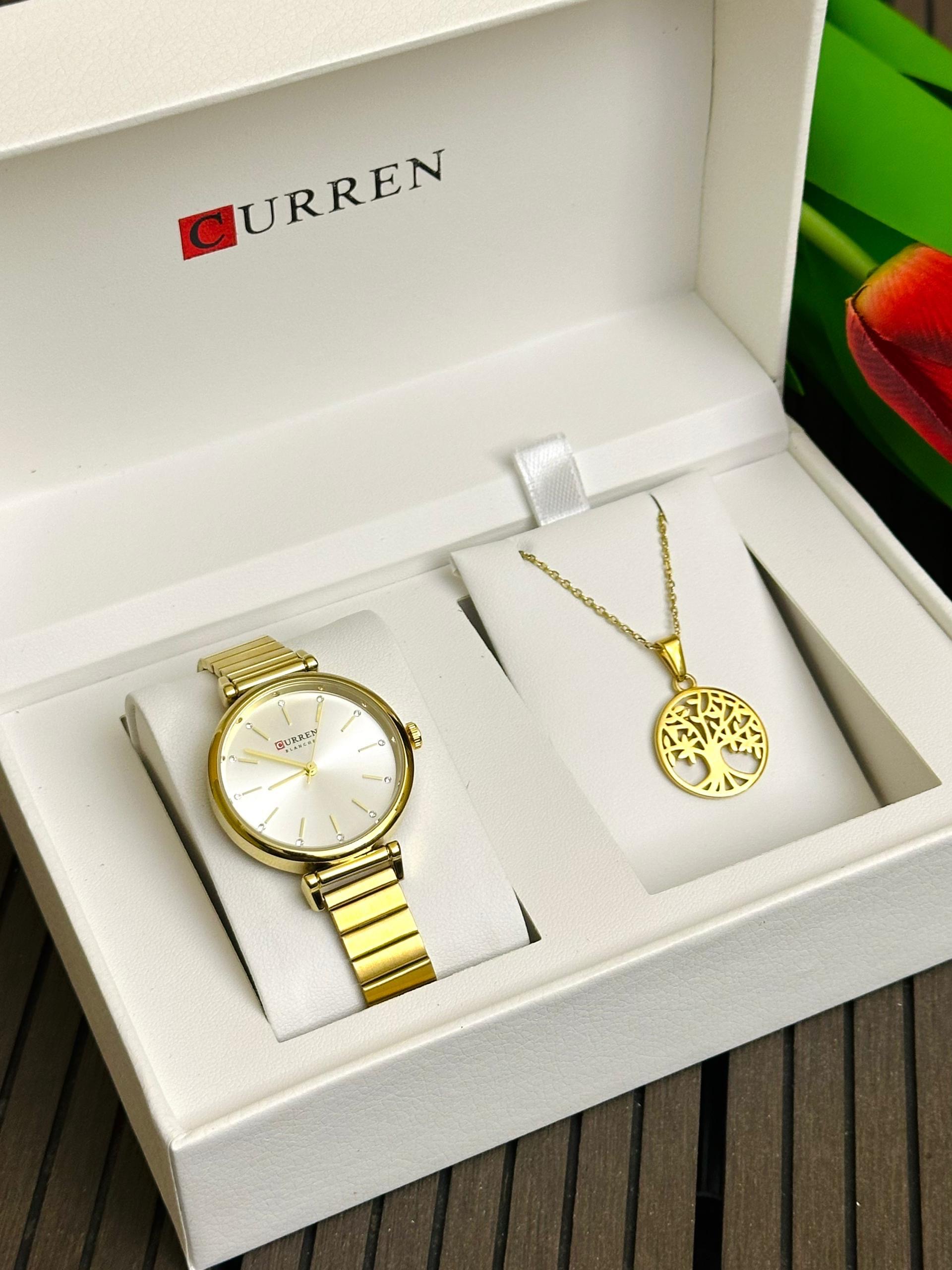 Coffret montre dorée et pendentif arbre
